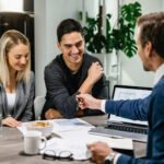 Business consultants discussing business loan plans with clients in UAE